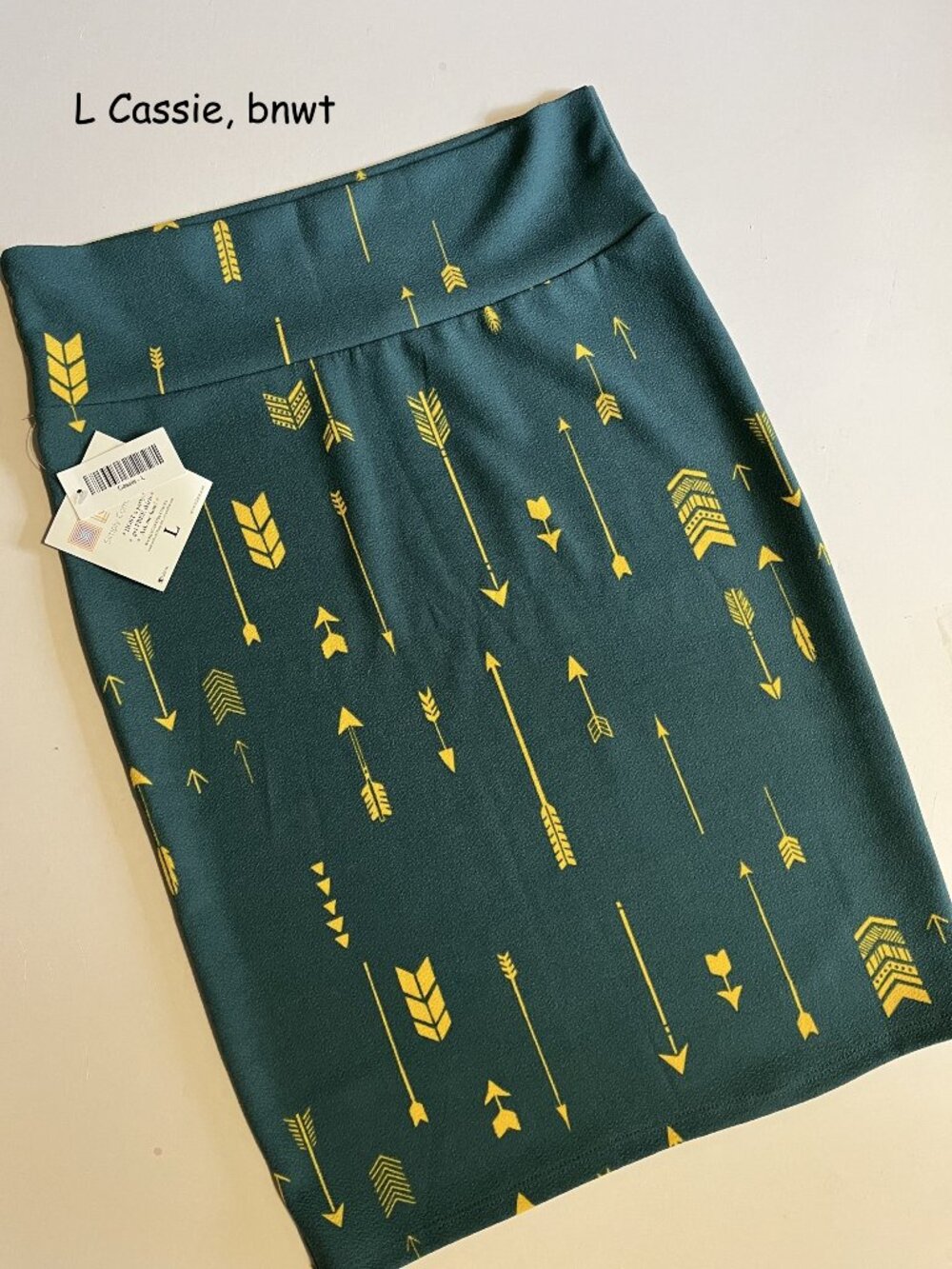 Large Lularoe Cassie pencil skirt, blue with yellow arrows